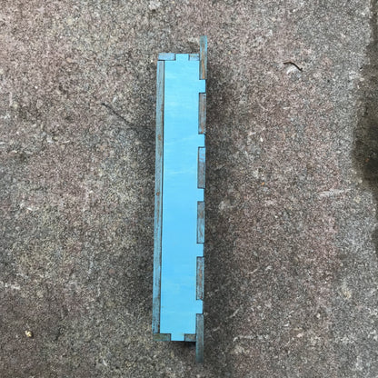 side view of blue painted mezuzah