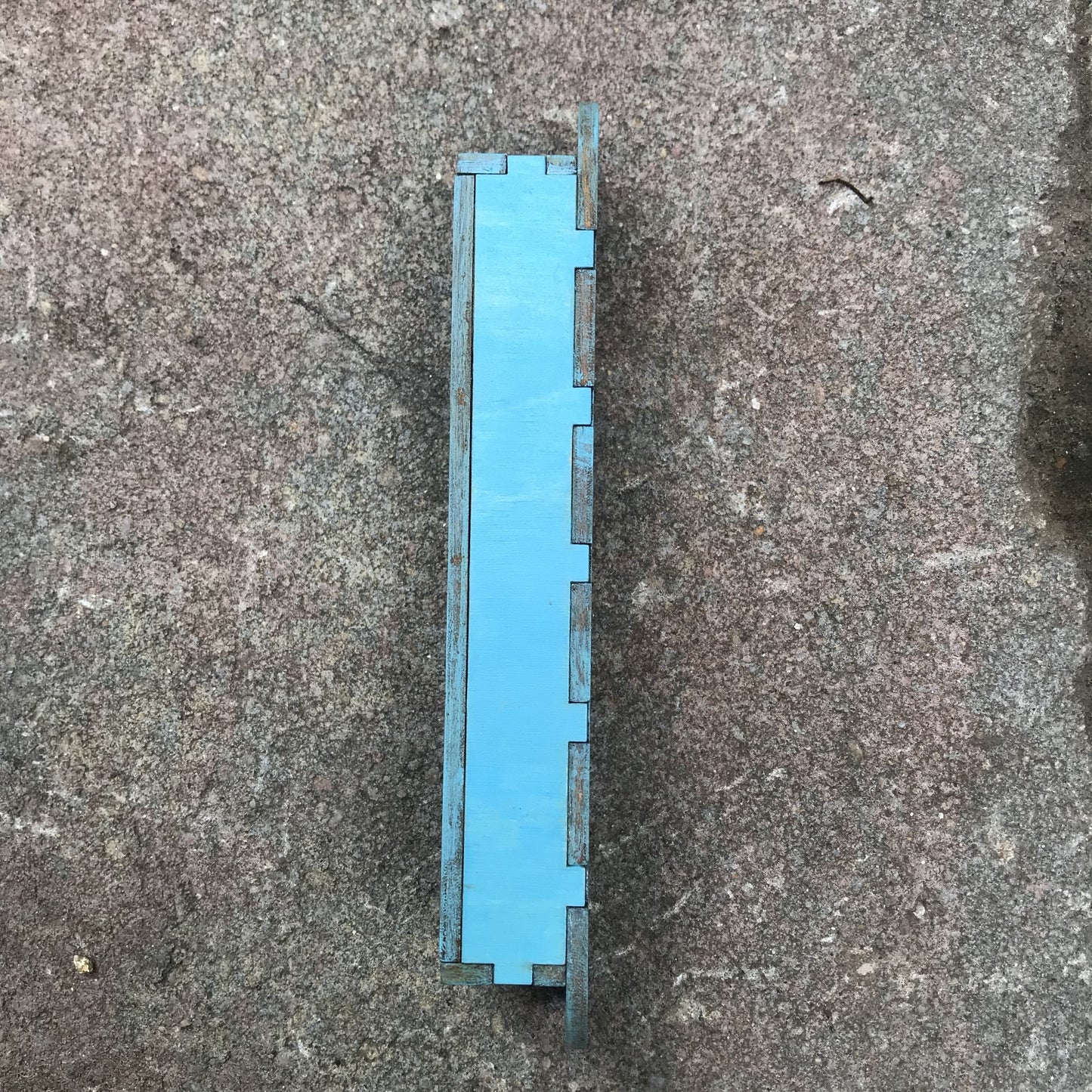 side view of blue mezuzah