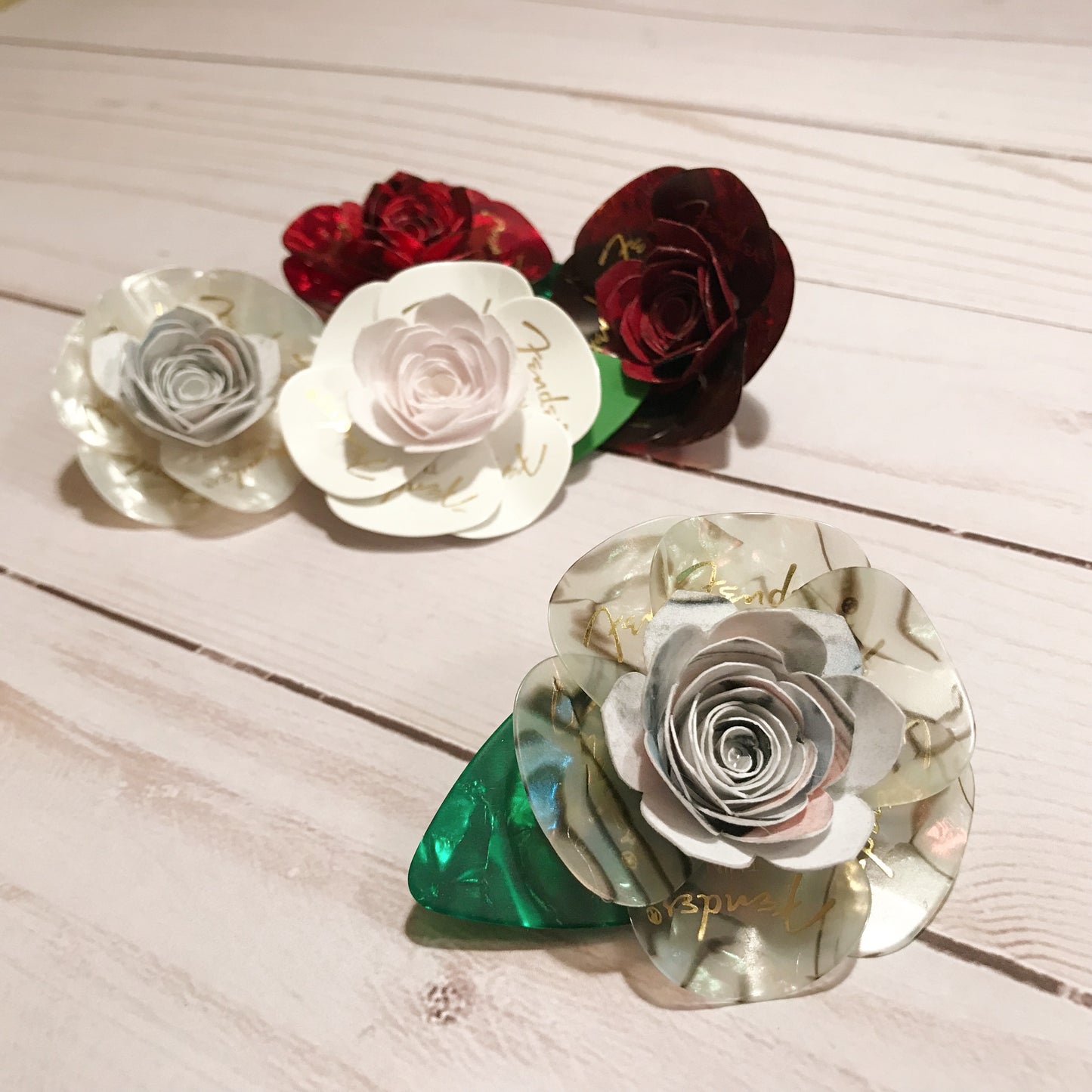 Guitar pick boutonniere - grey abalone