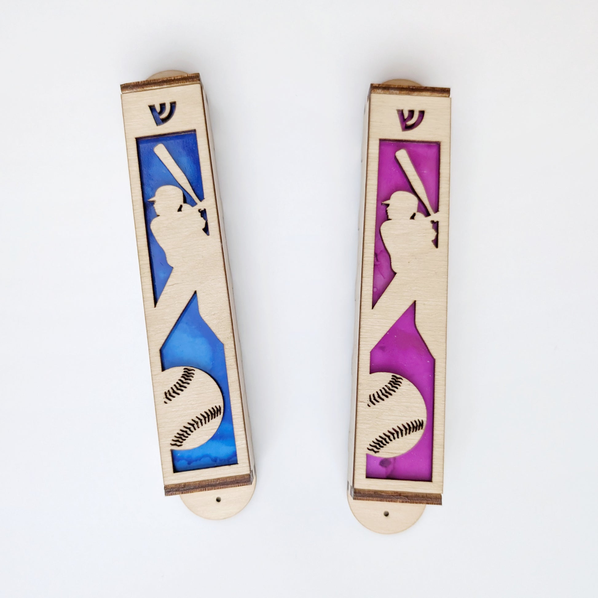 Two wooden bookmarks with silhouettes of a female softball player and ball on a white background